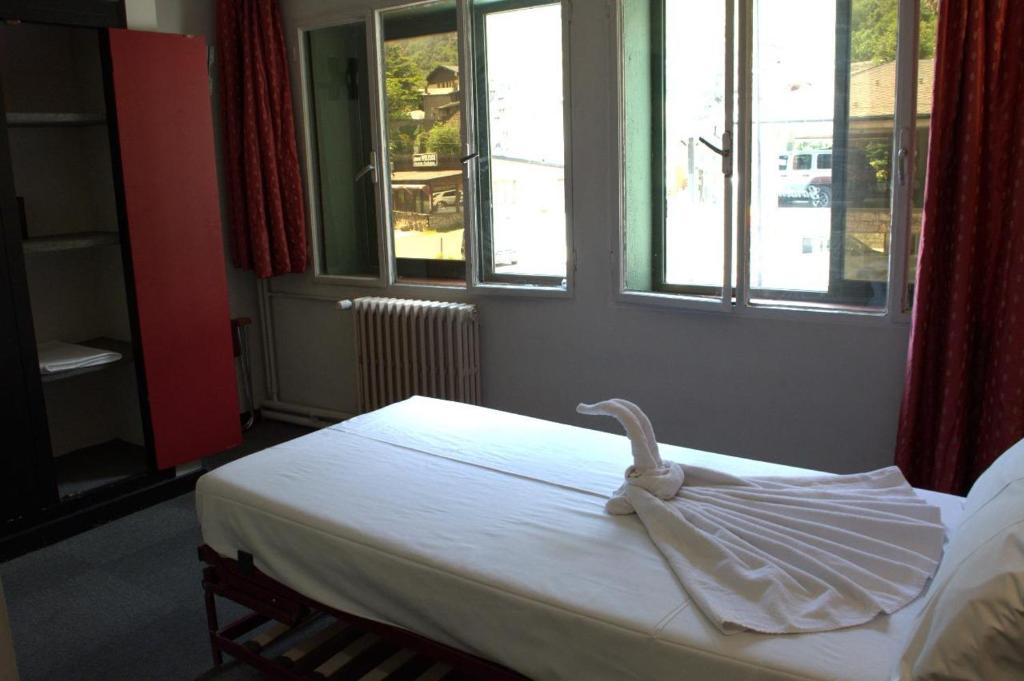 Postel nebo postele na pokoji v ubytování Hotel Garden