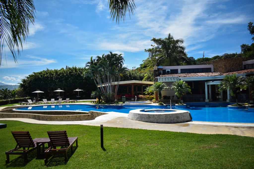Бассейн в Apartamento en condominio Avalon Country Club,Santa Ana, 4 personas, terraza, restaurante, piscina, tenis,ideal para mascotas или поблизости