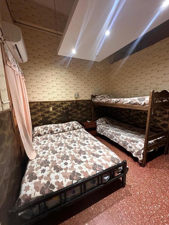 Postel nebo postele na pokoji v ubytování Hospedaje Artigas