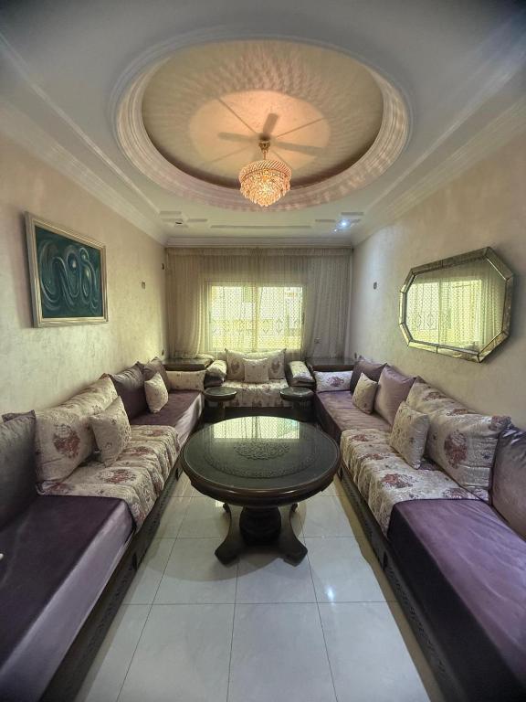 Posezení v ubytování Spacious Appartment in the heart of Tangier with 2 living rooms, 2 bedrooms KING SIZE beds, 2 baths, 2 patios