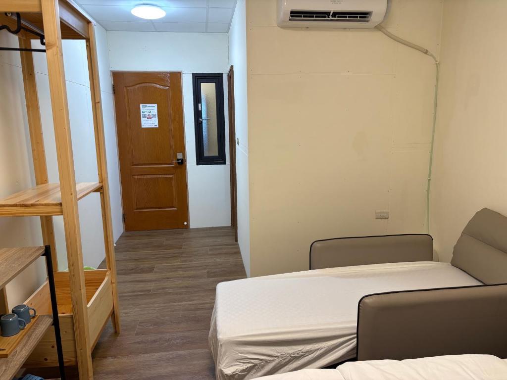 Postel nebo postele na pokoji v ubytování 水源棧