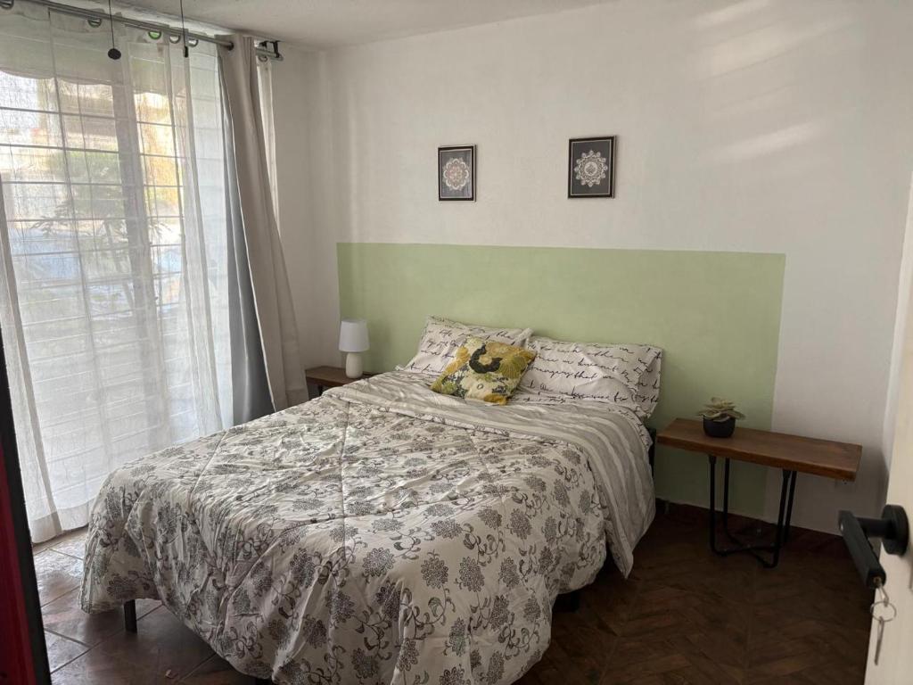 Ένα ή περισσότερα κρεβάτια σε δωμάτιο στο Confortable depa cerca de Expo Guadalajara