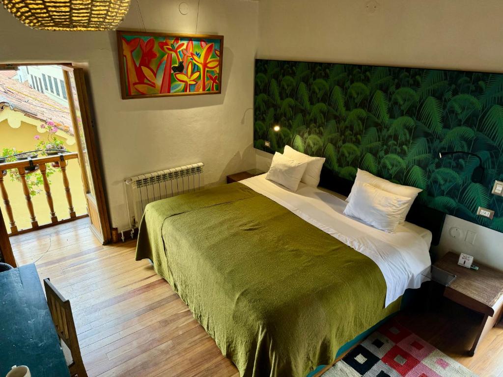 Postel nebo postele na pokoji v ubytování ARQUEOLOGO Exclusive Boutique Hotel Cusco - Centro Histórico