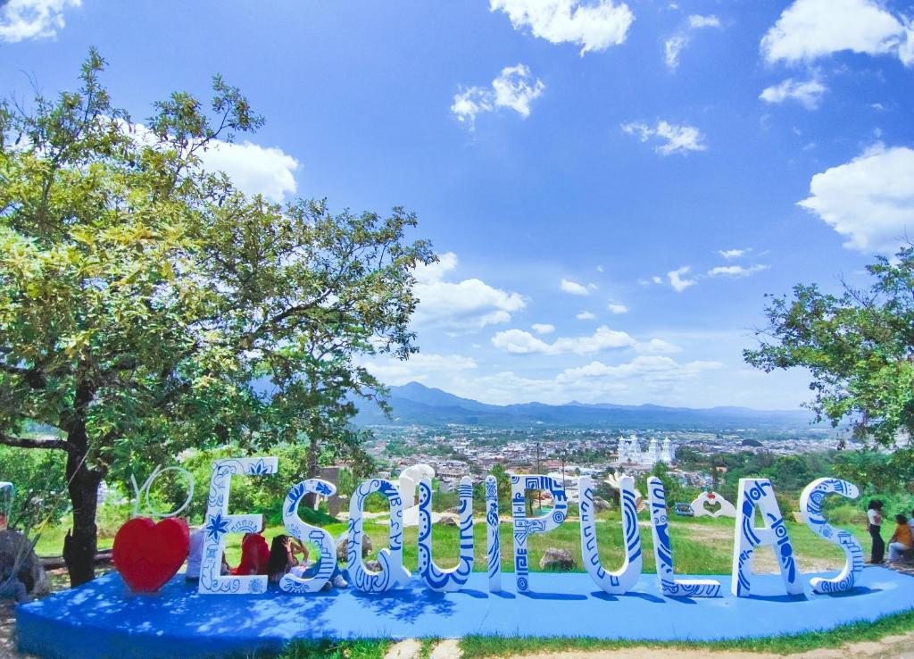 a sign that says peace on top of a hill at Casas DiversA in Esquipulas