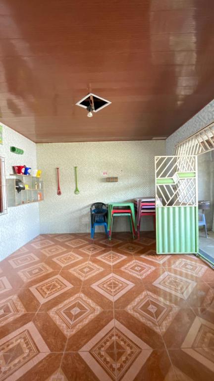 a room with a table and two stools in it at JLM Pereira in Marituba