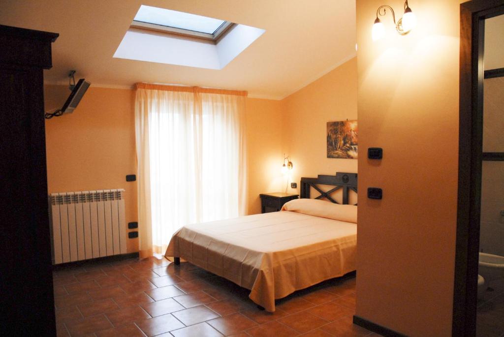 Postel nebo postele na pokoji v ubytování Hotel Alisma