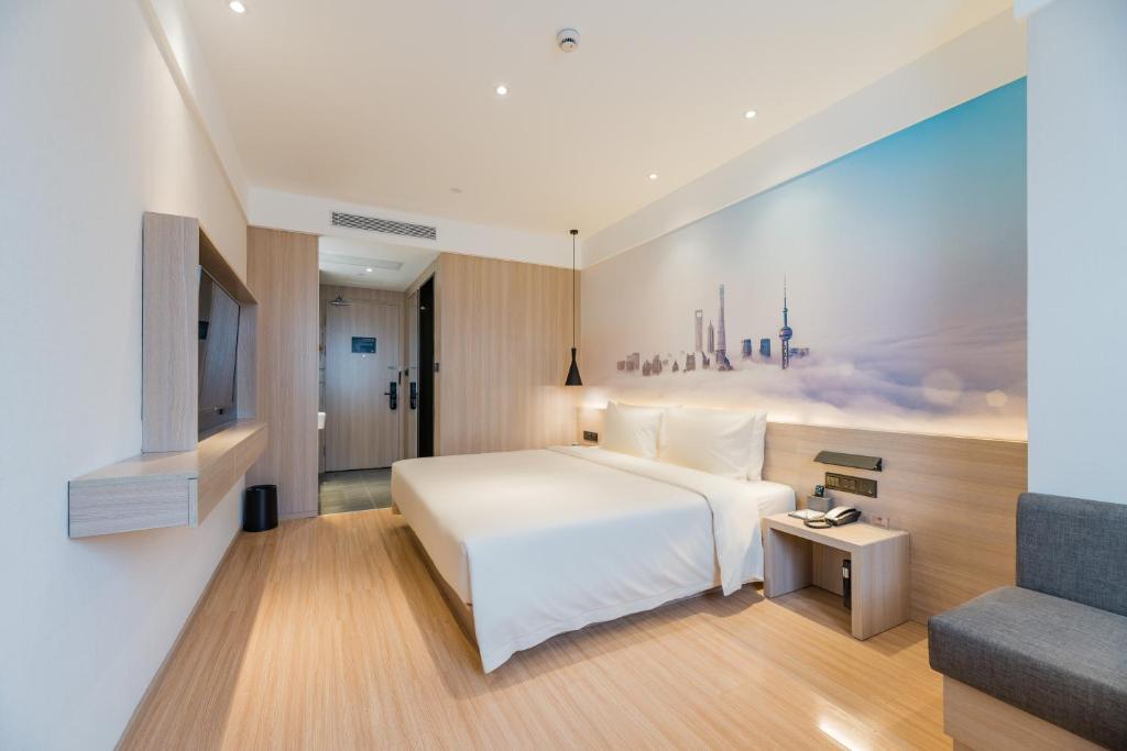 Postel nebo postele na pokoji v ubytování Atour Hotel Shanghai Hongqiao International Exhibition Beixinjing