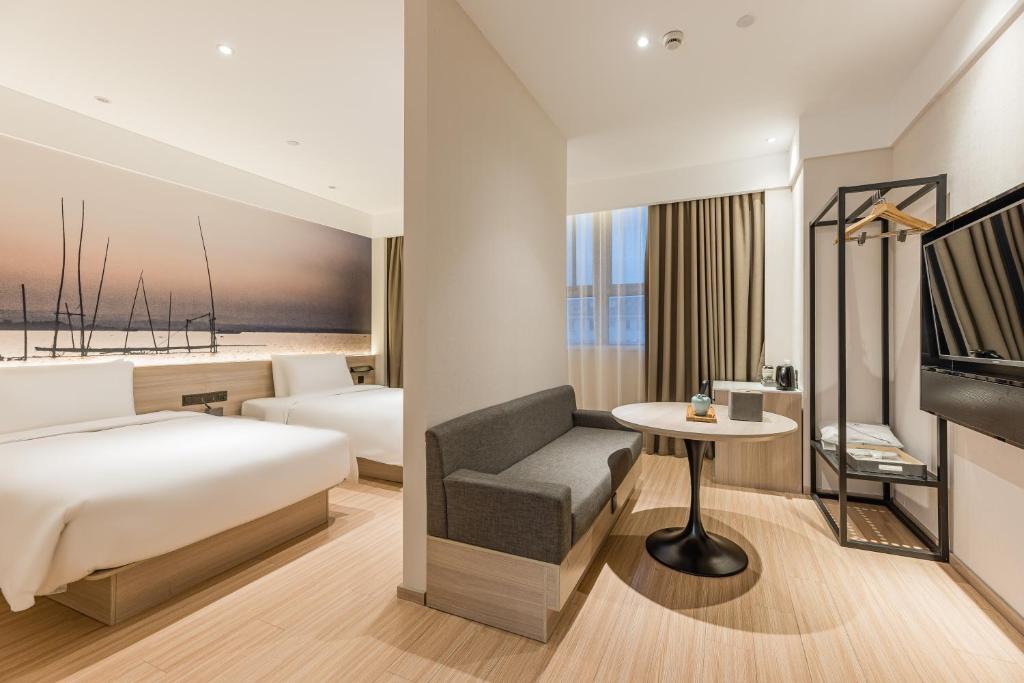 Postel nebo postele na pokoji v ubytování Atour Hotel Shanghai Hongqiao International Exhibition Beixinjing
