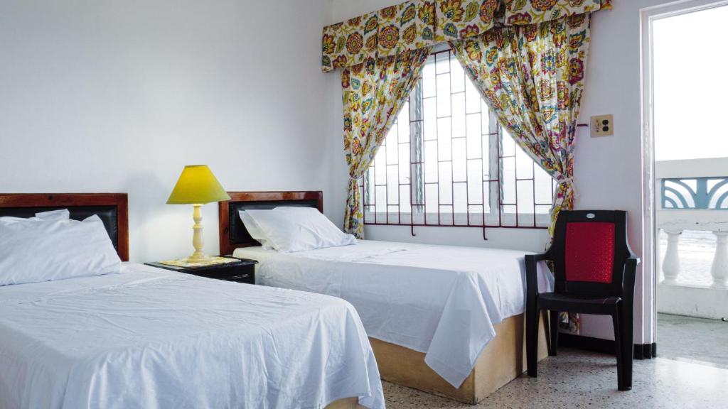 Postel nebo postele na pokoji v ubytování Blue Haven Guesthouse