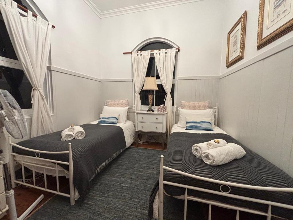 Postel nebo postele na pokoji v ubytování Celestial Dew Guesthouse in Tyalgum
