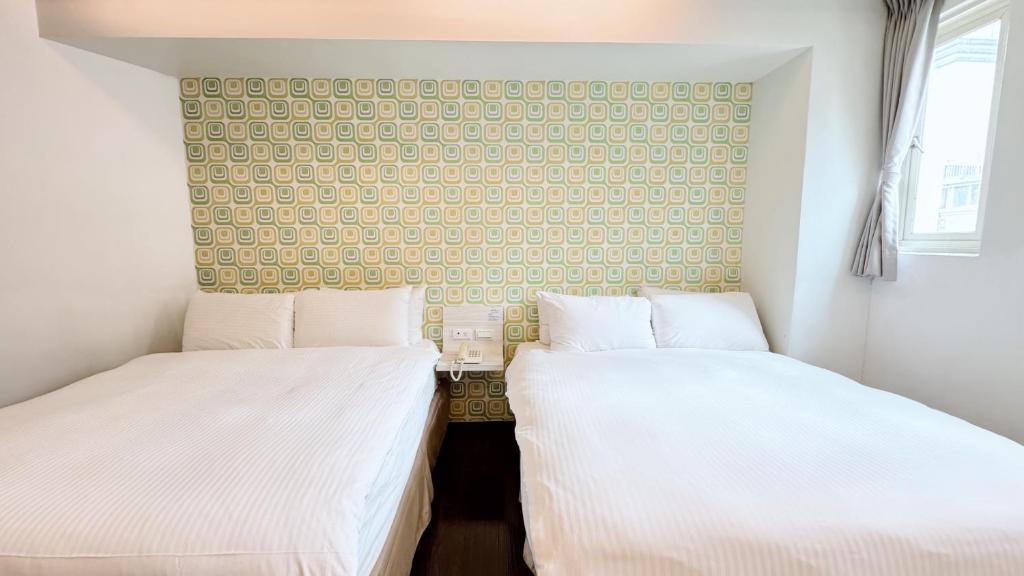 Postel nebo postele na pokoji v ubytování Youai Jiaoxi Hot Spring Hotel