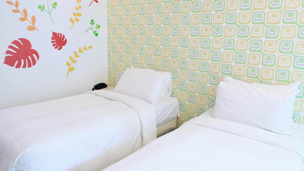 Postel nebo postele na pokoji v ubytování Youai Jiaoxi Hot Spring Hotel