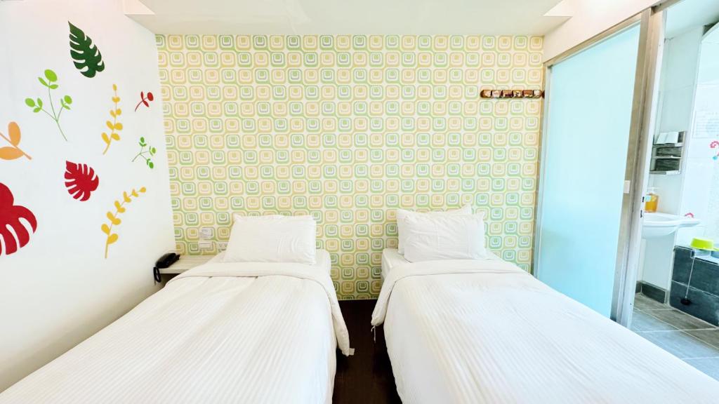 Postel nebo postele na pokoji v ubytování Youai Jiaoxi Hot Spring Hotel