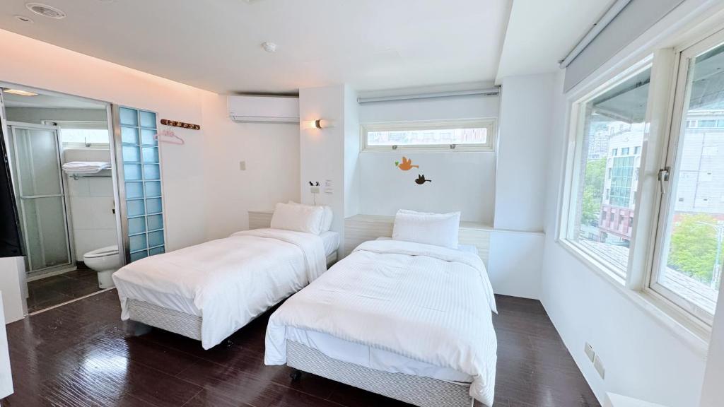 Postel nebo postele na pokoji v ubytování Youai Jiaoxi Hot Spring Hotel