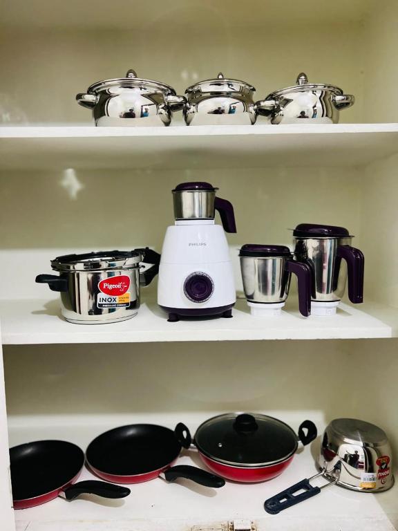 Kuchyň nebo kuchyňský kout v ubytování Abode Stayz Service Apartments