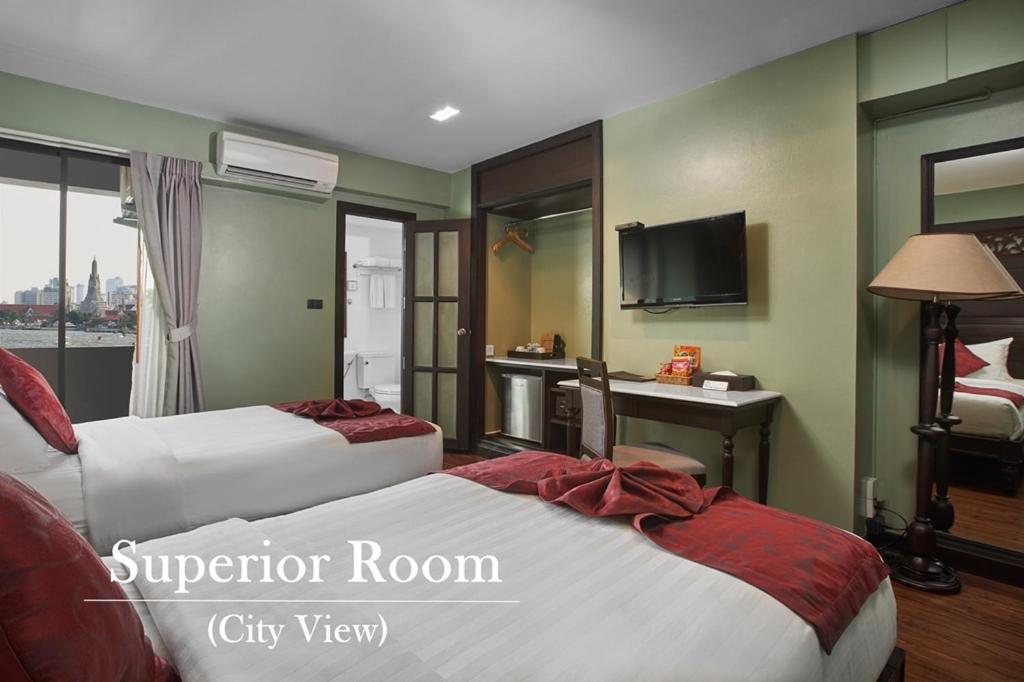 Postel nebo postele na pokoji v ubytování Baan Wanglang Riverside, Bangkok