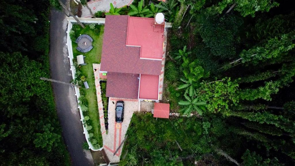 an overhead view of a house with a pink roof at Vamsi's Woodside in Yercaud