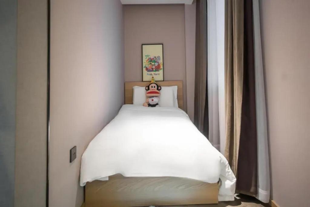 Postel nebo postele na pokoji v ubytování Atour Hotel Shanghai Caohejing