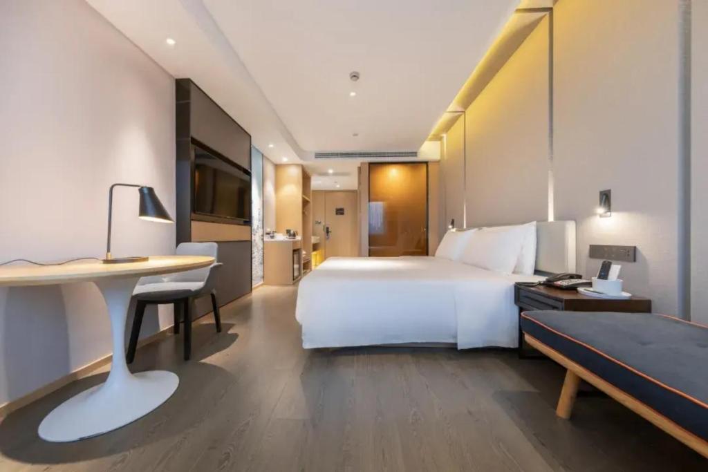 Postel nebo postele na pokoji v ubytování Atour Hotel Shanghai Caohejing