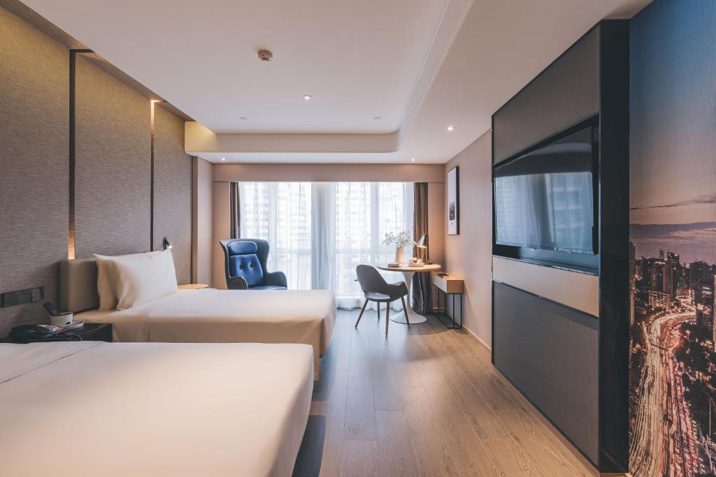 Postel nebo postele na pokoji v ubytování Atour S Hotel Shanghai Xujiahui Tianyaoqiao