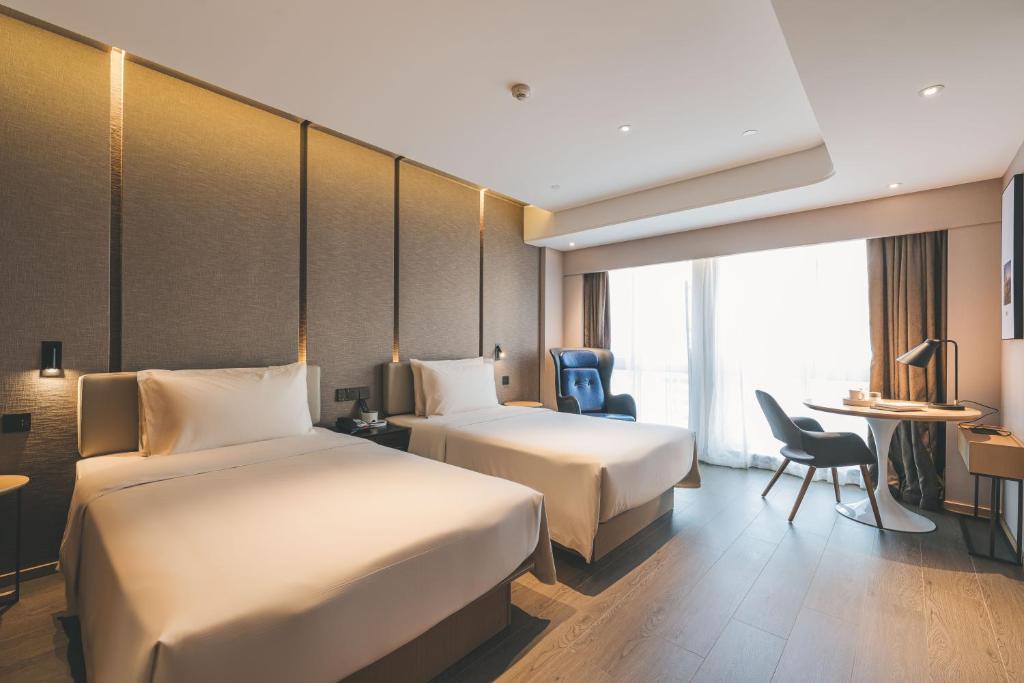Postel nebo postele na pokoji v ubytování Atour S Hotel Shanghai Xujiahui Tianyaoqiao