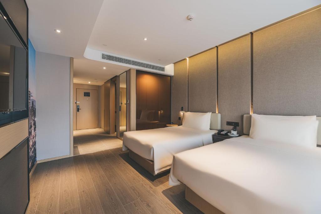 Postel nebo postele na pokoji v ubytování Atour S Hotel Shanghai Xujiahui Tianyaoqiao