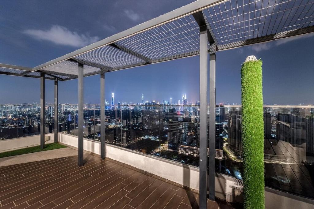 a view of a city skyline from the top of a building at Cozy Stay in KLCC吉隆玻 in Kuala Lumpur