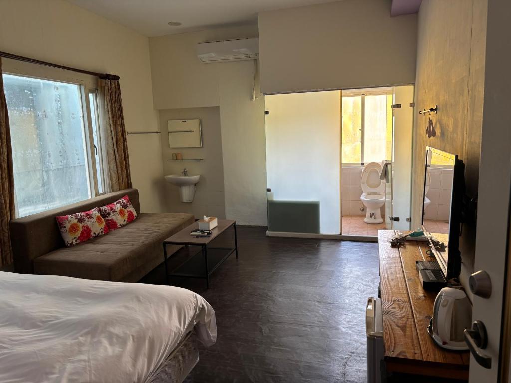 Postel nebo postele na pokoji v ubytování Hearty Homestay