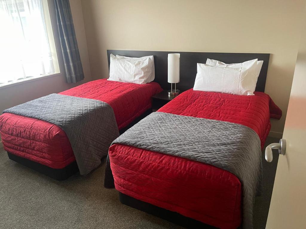 Postel nebo postele na pokoji v ubytování 388 Tay Motel