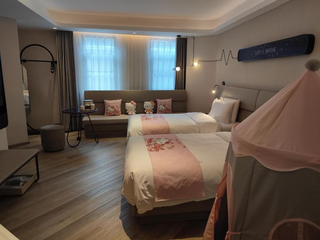 Postel nebo postele na pokoji v ubytování Atour Light Hotel Shanghai Xujiahui Jiaotong University