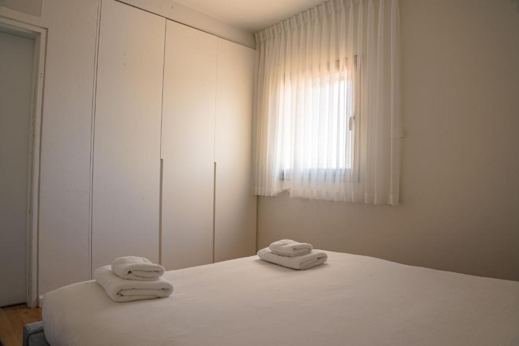 Postel nebo postele na pokoji v ubytování Hematian Hotel by Effy