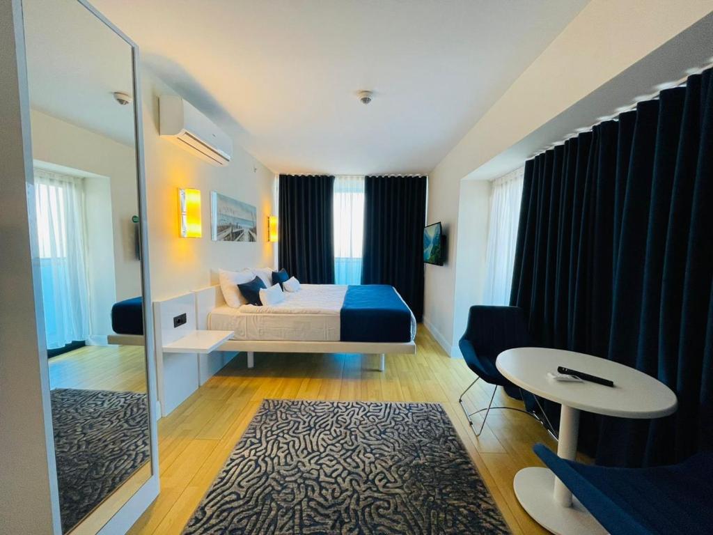 Postel nebo postele na pokoji v ubytování Batumi VIP hotel