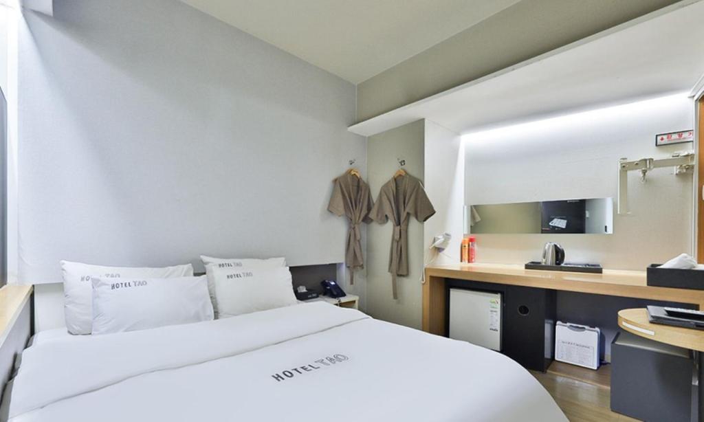 Postel nebo postele na pokoji v ubytování Hotel TAO