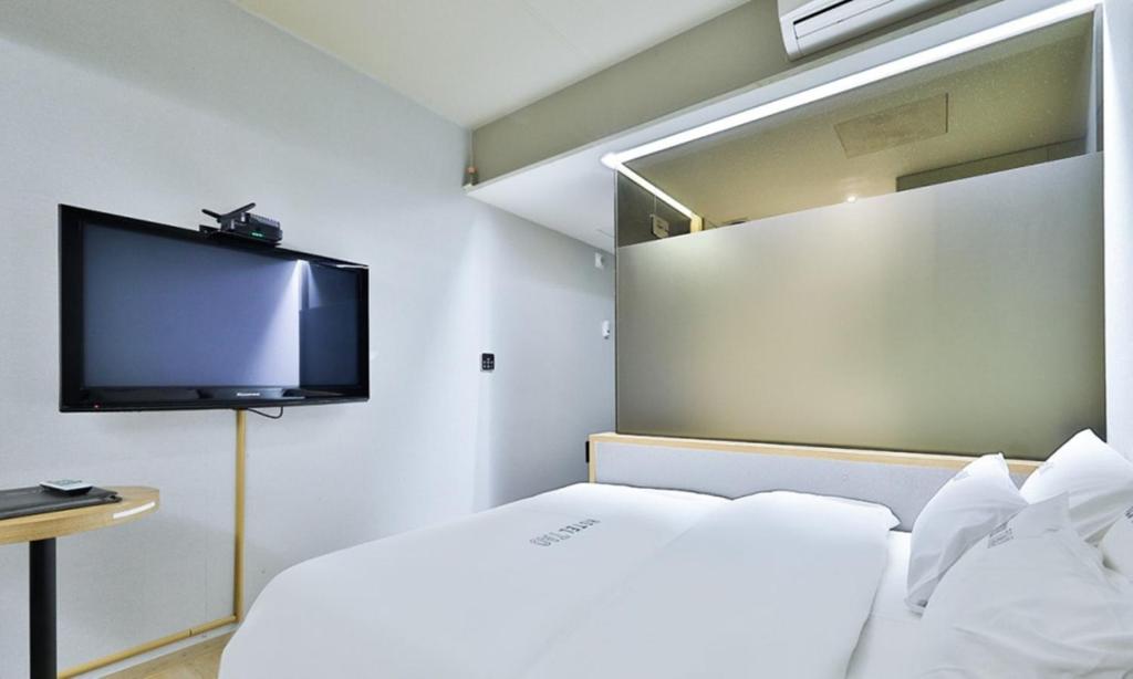 Postel nebo postele na pokoji v ubytování Hotel TAO