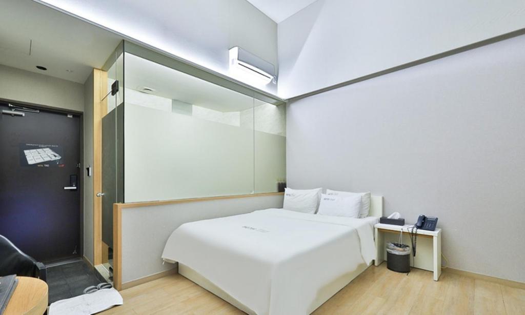 Postel nebo postele na pokoji v ubytování Hotel TAO