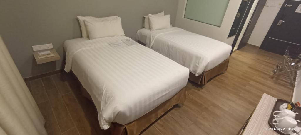 Postel nebo postele na pokoji v ubytování The Klagan Hotel