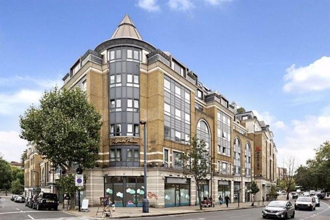 a large building on the corner of a street at 1 Bedroom Apartment with security 24 hours in London