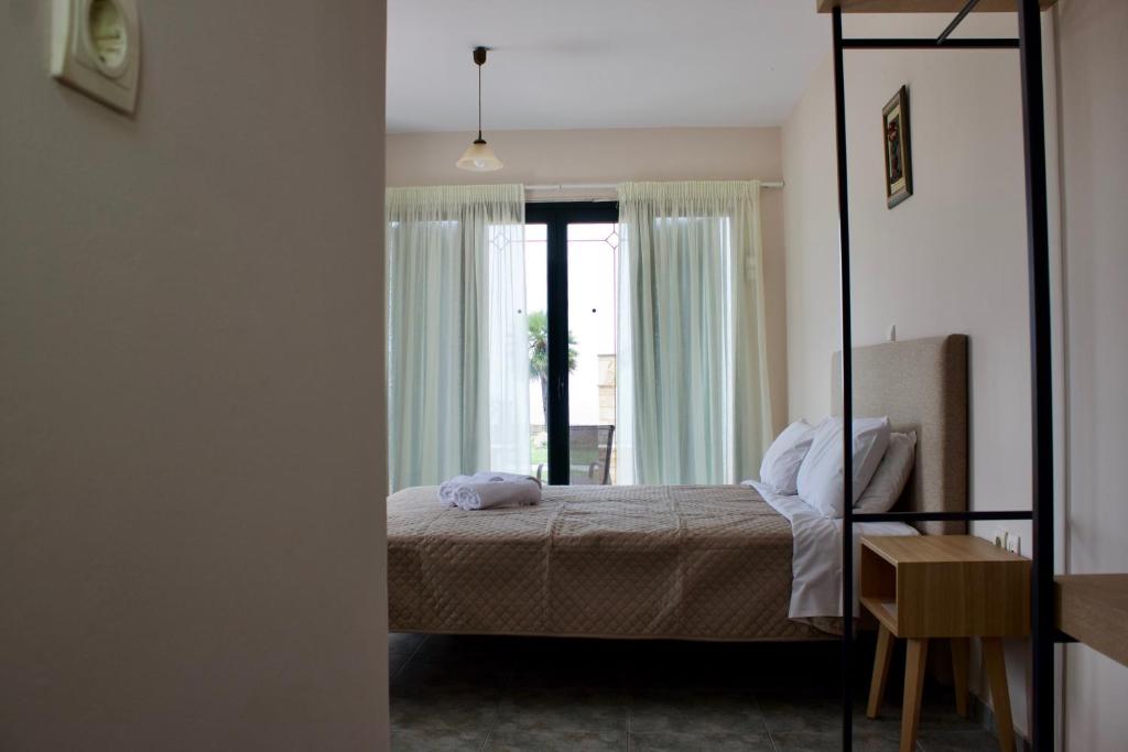 A bed or beds in a room at Niforos Panorama