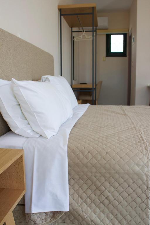 A bed or beds in a room at Niforos Panorama