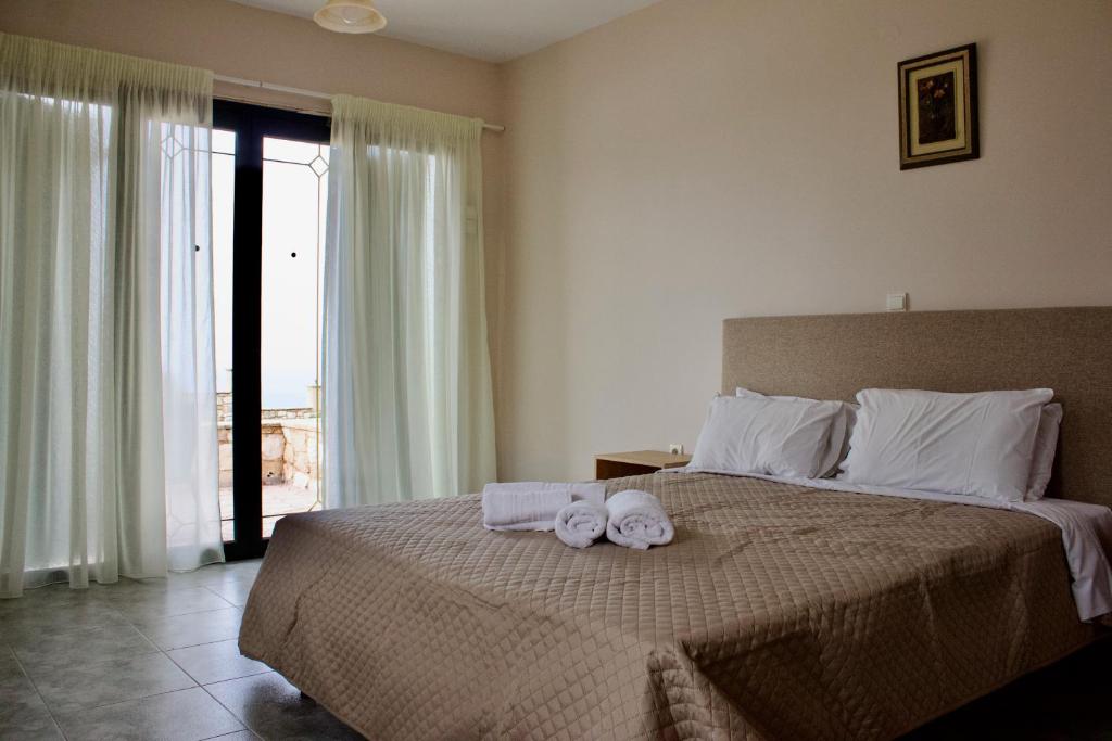A bed or beds in a room at Niforos Panorama