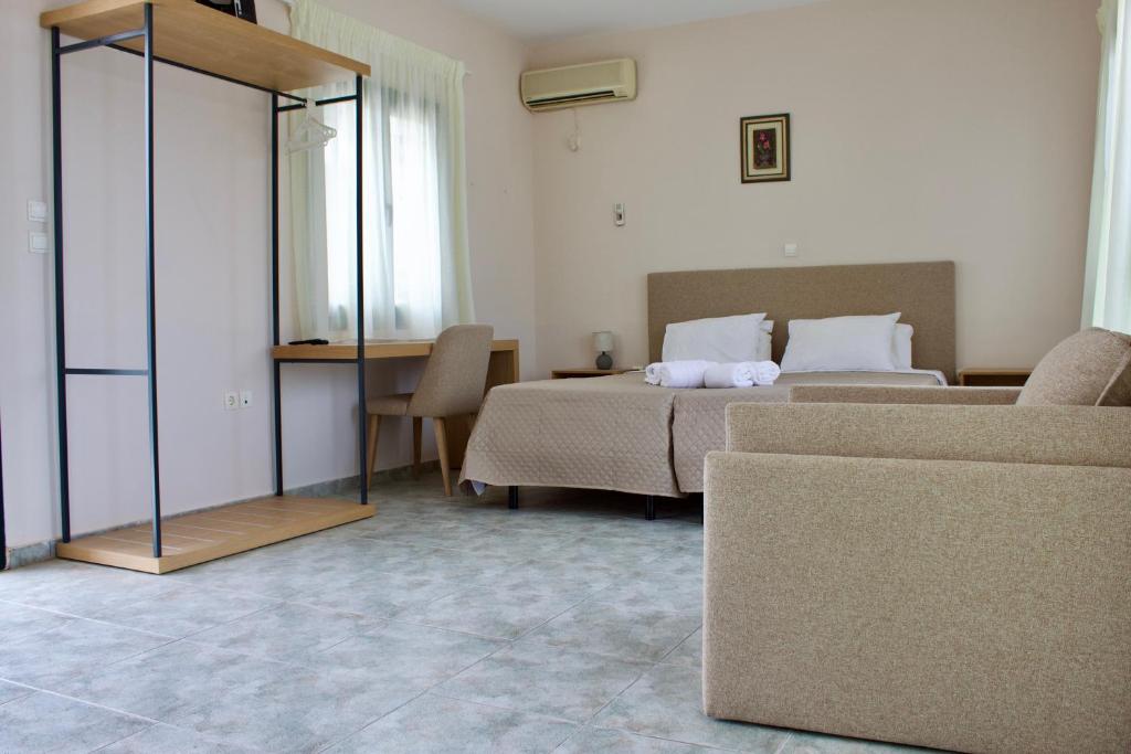 A bed or beds in a room at Niforos Panorama
