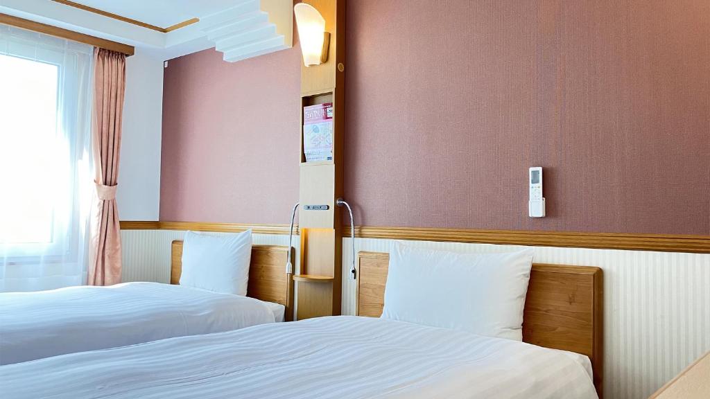 Кровать или кровати в номере Toyoko Inn Morioka eki Minami guchi Ekimae