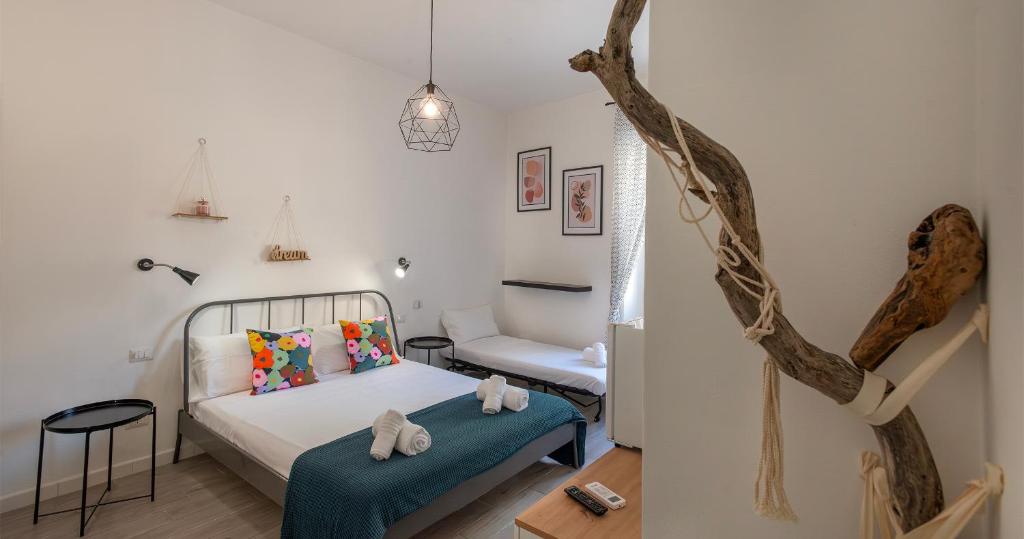 Postel nebo postele na pokoji v ubytování Le Pigne - Mare e Relax