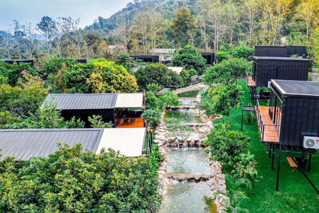 an aerial view of a river with houses at Green Love Garden Resort in Ban Bung Mai