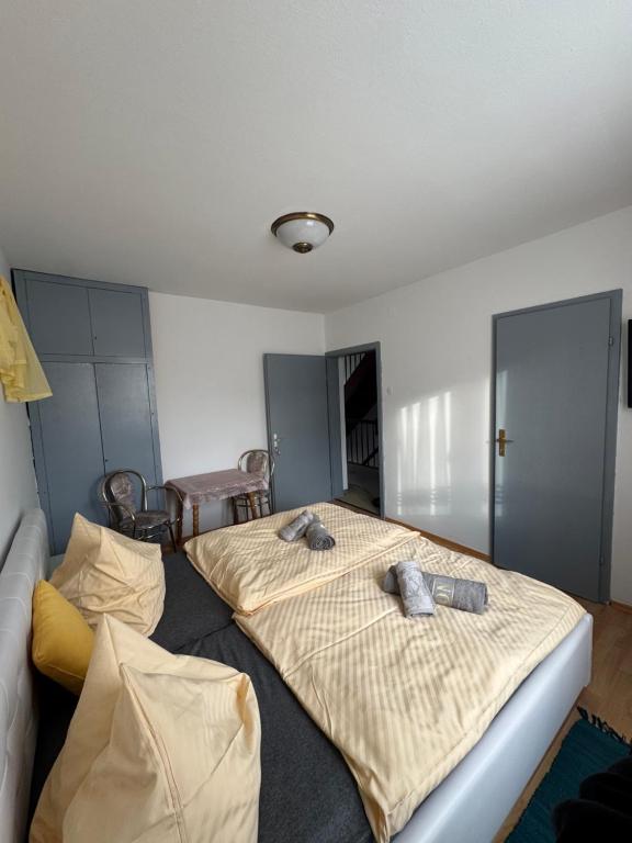 Postel nebo postele na pokoji v ubytování Guesthouse-Mother