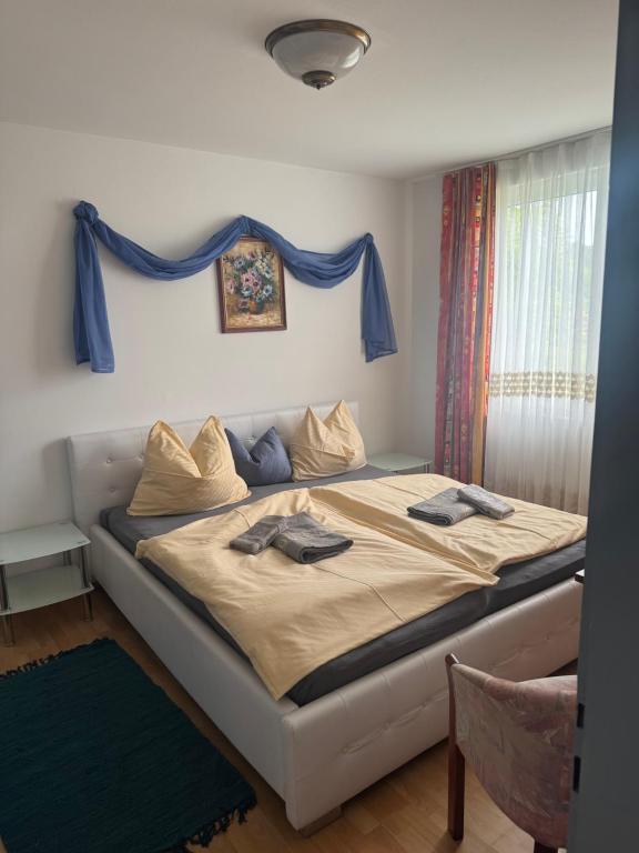 Postel nebo postele na pokoji v ubytování Guesthouse-Mother