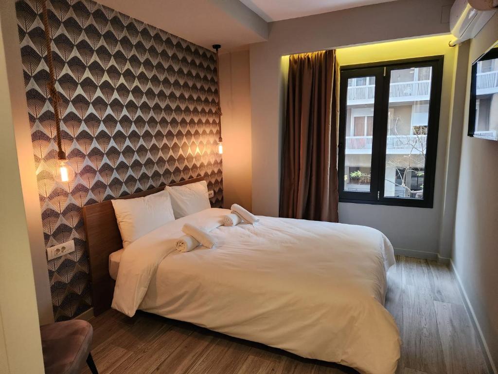 Postel nebo postele na pokoji v ubytování Urban Core Residence