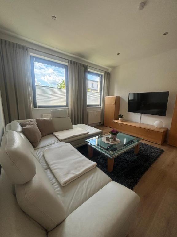 TV a/nebo společenská místnost v ubytování Ferienwohnung Alte Volksbank Nauendorf