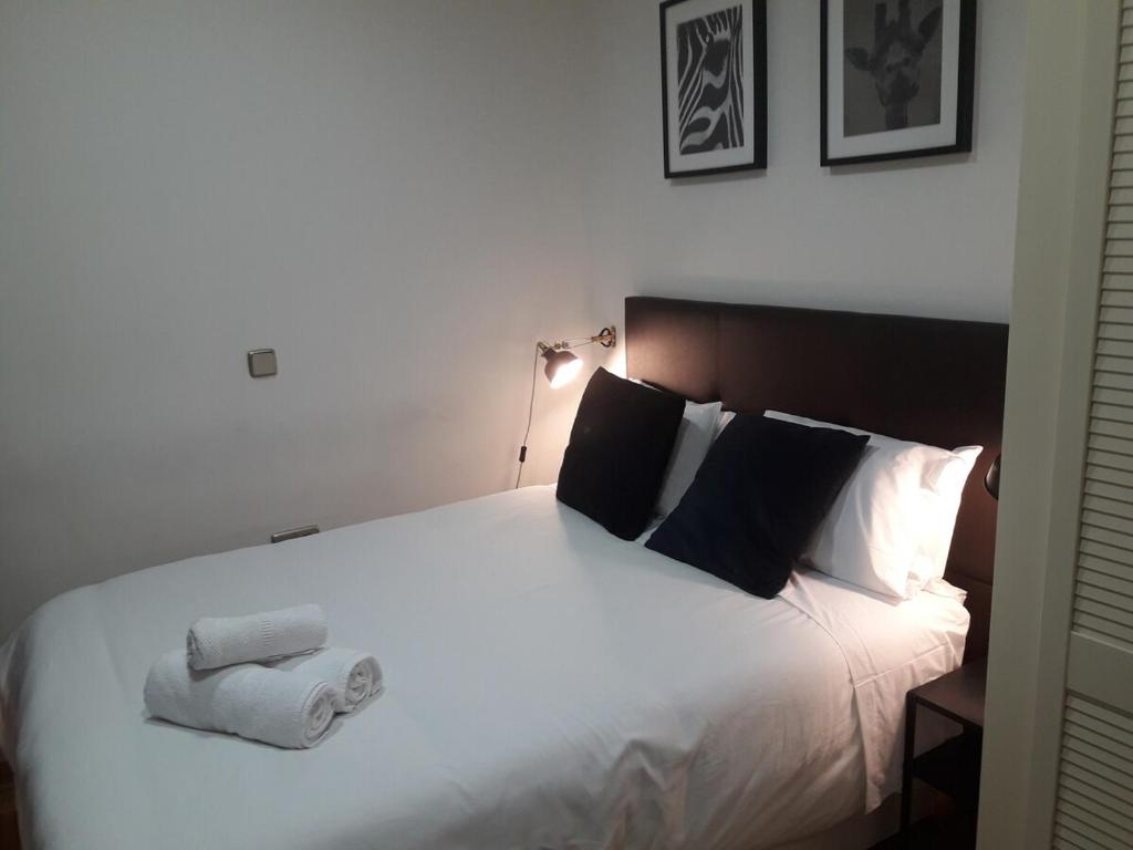 En eller flere senge i et værelse på Exyca Chueca