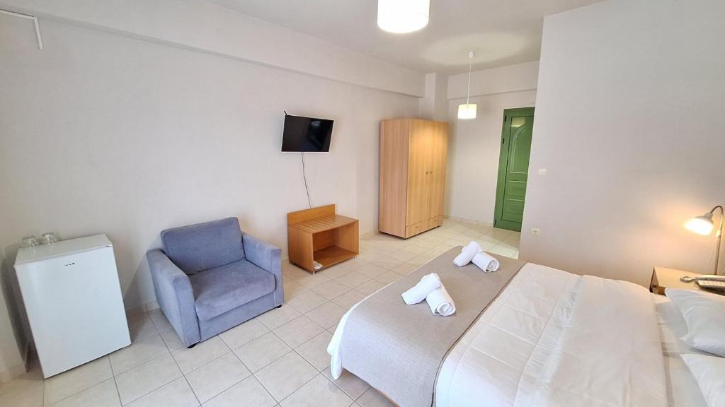 Posteľ alebo postele v izbe v ubytovaní Evita's Resort